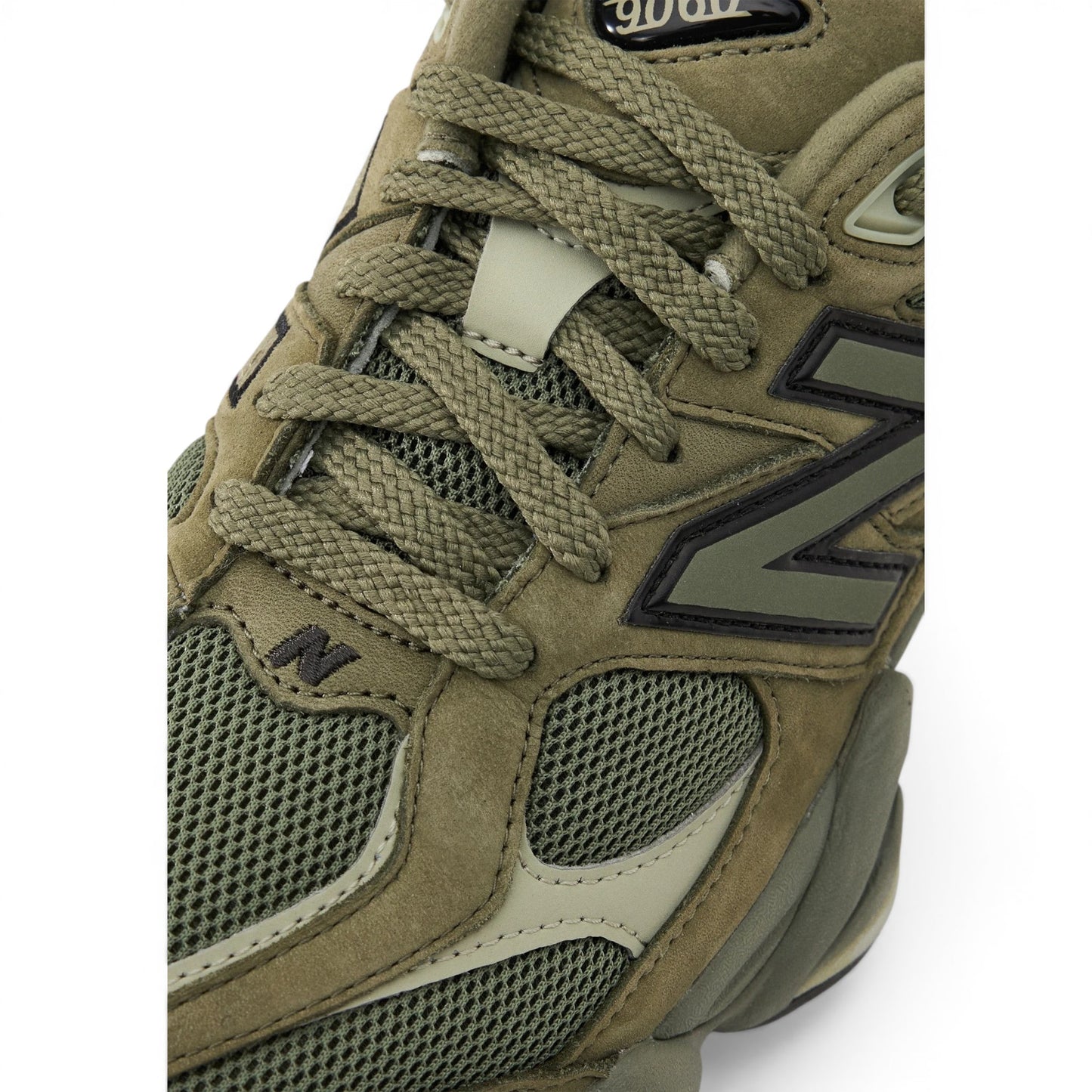 Urbanstyle New Balance 9060 olive green suede and mesh sneakers with chunky sole and N logo.
