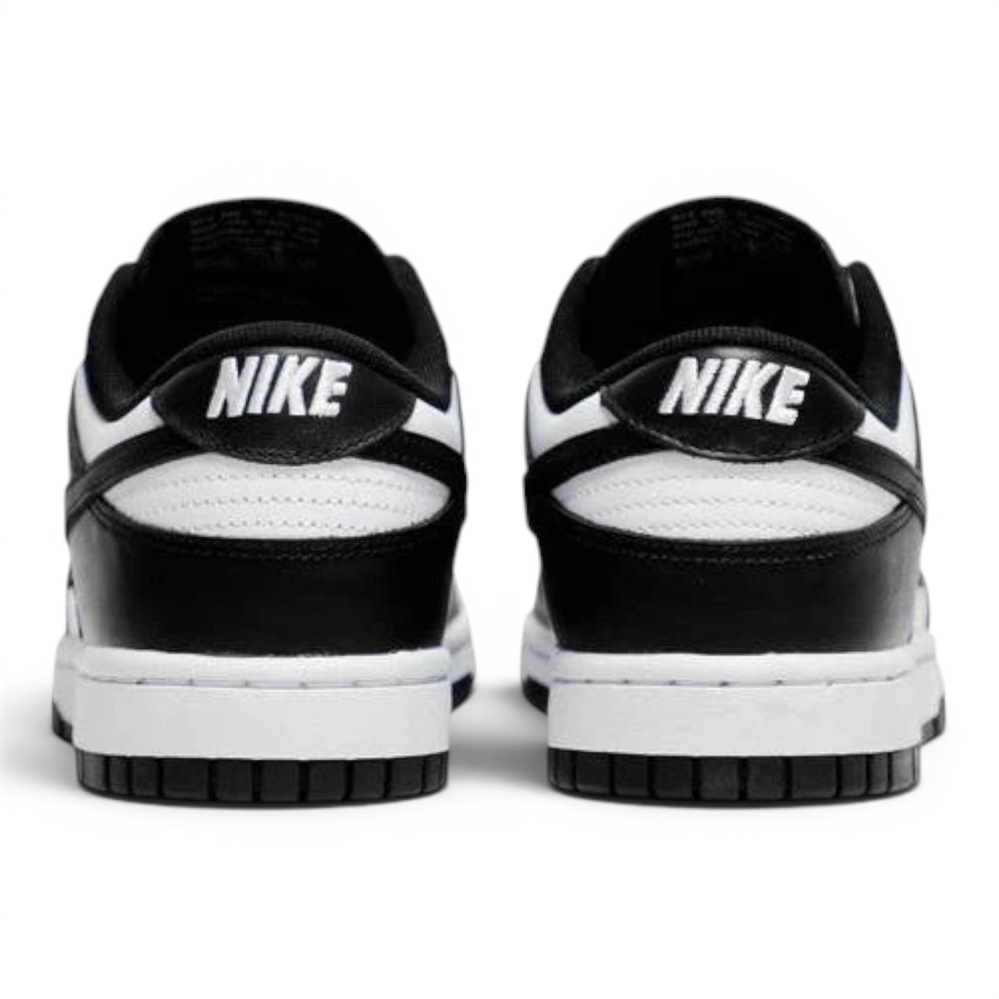 Urbanstyle black and white leather low top sneakers with Nike branding on heel.