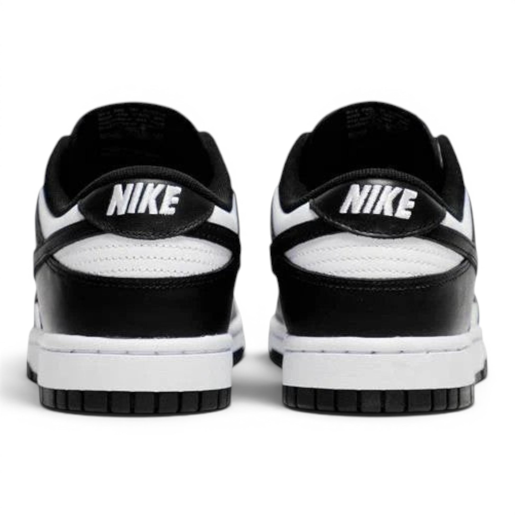 Urbanstyle black and white leather low top sneakers with Nike branding on heel.