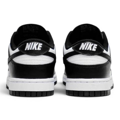 Urbanstyle black and white leather low top sneakers with Nike branding on heel.