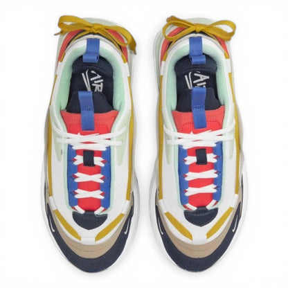 urbanstyle layered chunky athletic sneakers with white, yellow, red, blue, and tan accents. Features intricate lacing and robust sole.