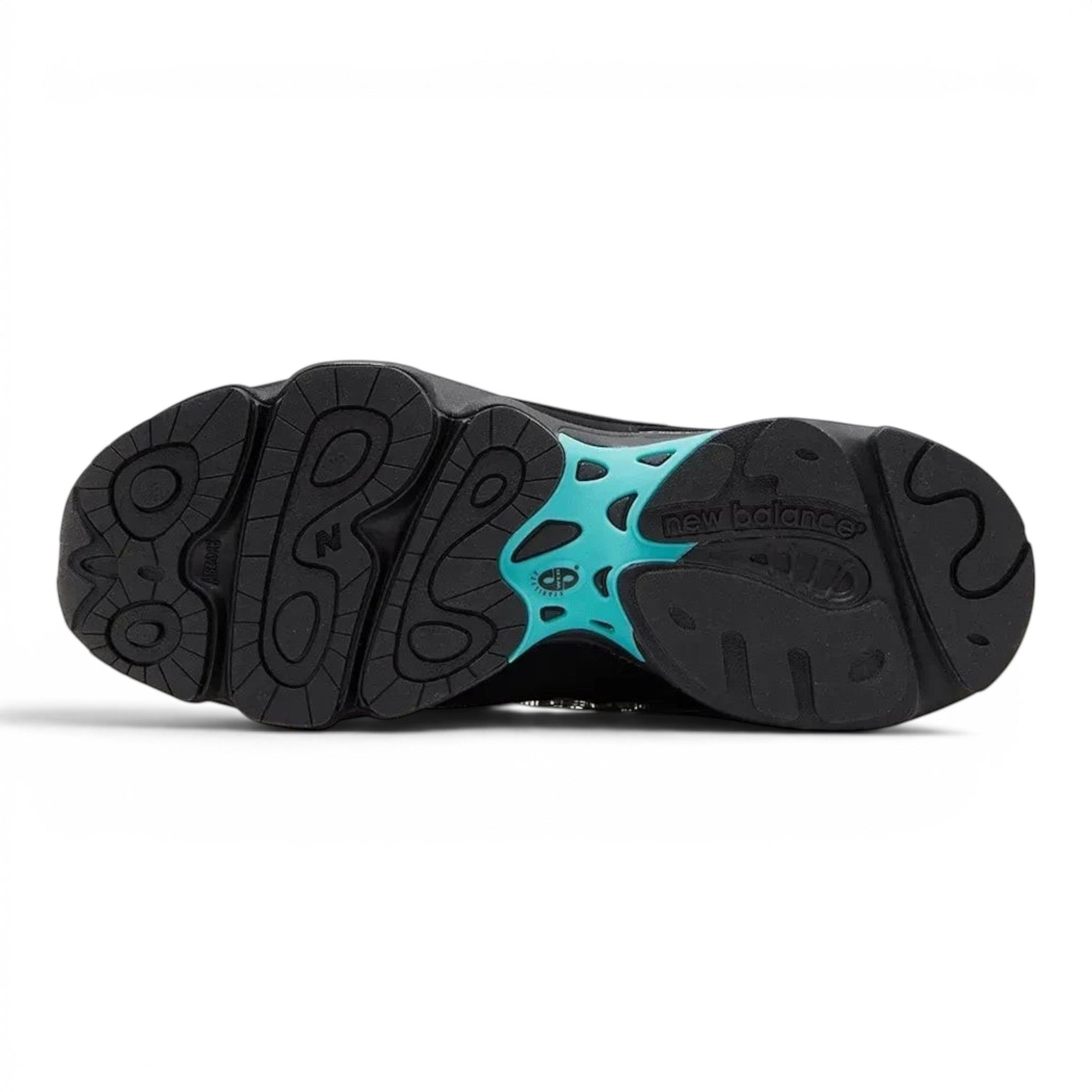 urbanstyle New Balance 1000 sneaker black rubber outsole with teal arch support and textured traction pattern