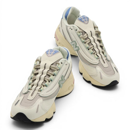 urbanstyle New Balance 1000 sneakers in off-white with pastel blue, green, and pink accents, featuring mesh and synthetic layers.