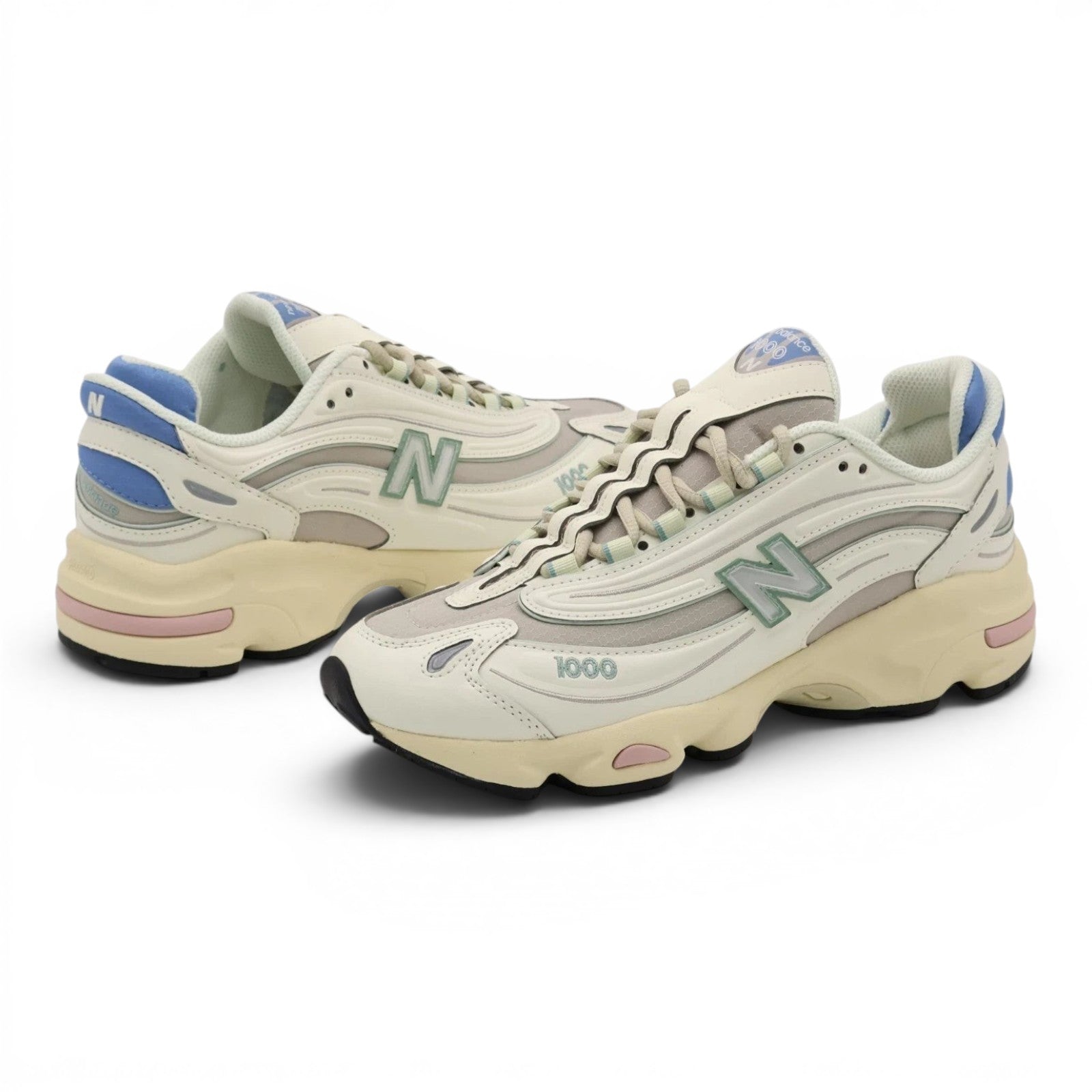 urbanstyle New Balance 1000 sneakers in off-white with pastel blue, green, and pink accents, featuring mesh and synthetic layers.