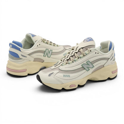 urbanstyle New Balance 1000 sneakers in off-white with pastel blue, green, and pink accents, featuring mesh and synthetic layers.