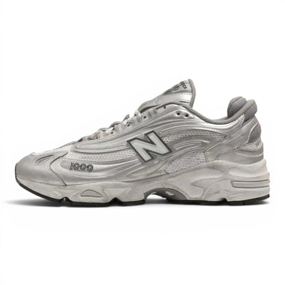 urbanstyle New Balance 1000 metallic silver lifestyle running sneakers with mesh upper and ABZORB cushioning.