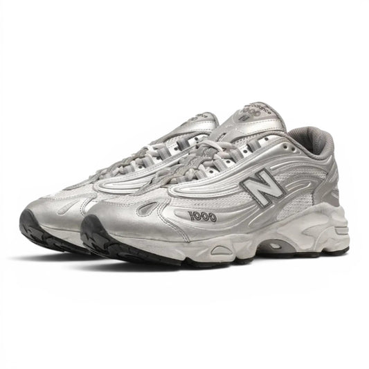 urbanstyle New Balance 1000 metallic silver lifestyle running sneakers with mesh upper and ABZORB cushioning.
