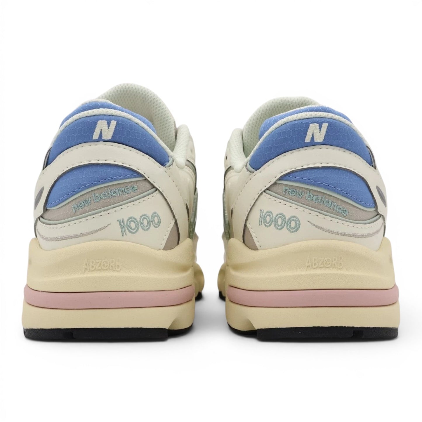 urbanstyle New Balance 1000 sneakers back view featuring off-white mesh, pastel blue, green, and pink accents.