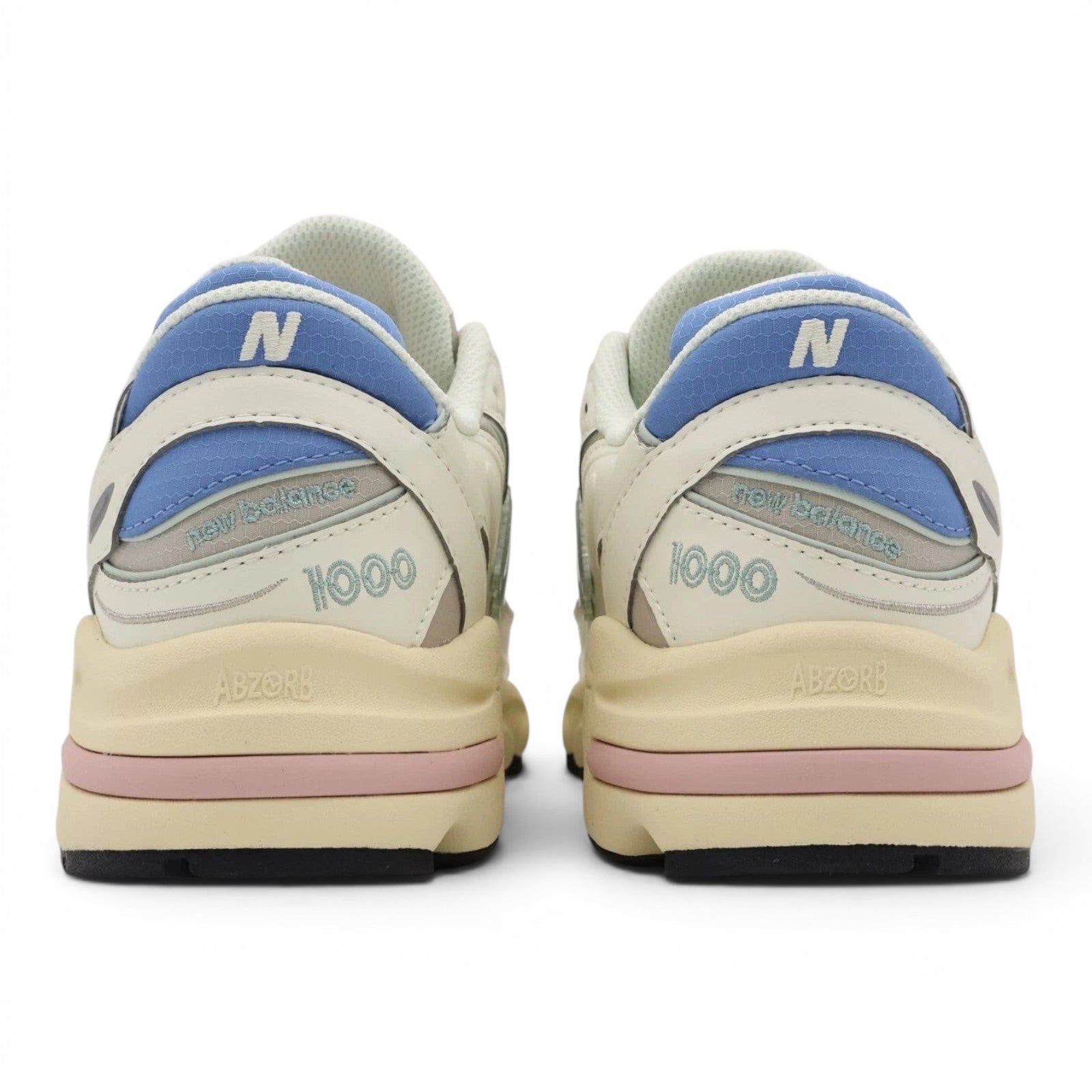 urbanstyle New Balance 1000 sneakers back view featuring off-white mesh, pastel blue, green, and pink accents.