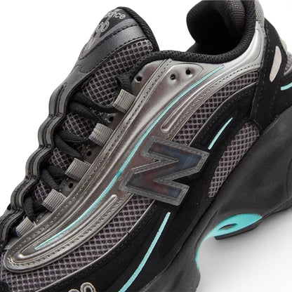 urbanstyle New Balance 1000 lifestyle sneakers in black and metallic silver with teal accents and mesh upper.