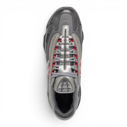 urbanstyle New Balance 1000 lifestyle running shoe in metallic silver and dark mesh with red accents.