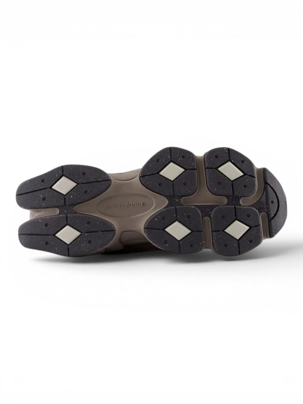 urbanstyle New Balance 9060 lifestyle sneaker showing the brown rubber outsole with textured grip and branding