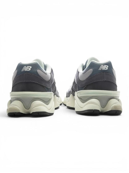 urbanstyle New Balance 9060 sneakers in charcoal and grey, showing the sculpted midsole and heel detail from behind.