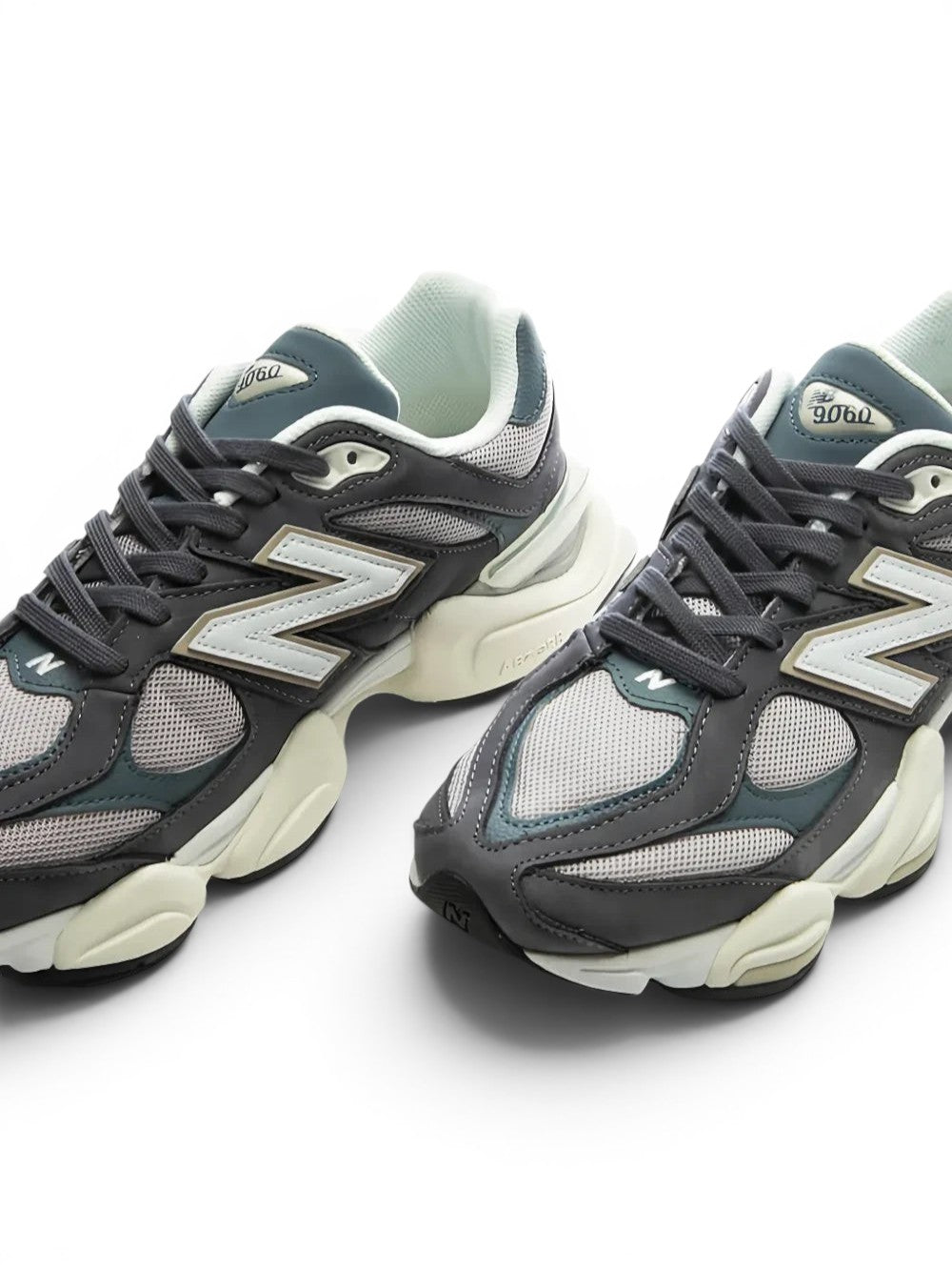 urbanstyle New Balance 9060 sneakers in charcoal, slate grey, and off-white with mesh and synthetic overlays.