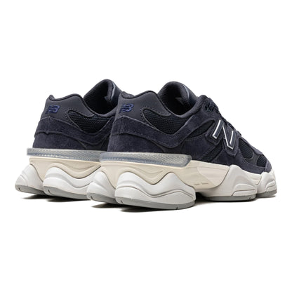 Urbanstyle navy blue New Balance 9060 suede and mesh sneakers with chunky sole and iconic N logo.