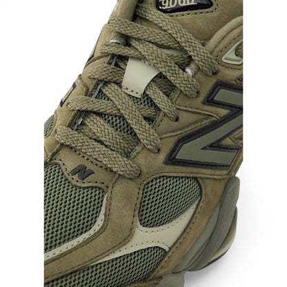 Urbanstyle New Balance 9060 olive green suede and mesh sneakers with chunky sole and N logo.