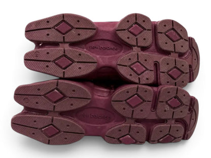 urbanstyle New Balance 9060 sneakers in burgundy showing the rugged rubber outsoles with a sculpted tread pattern