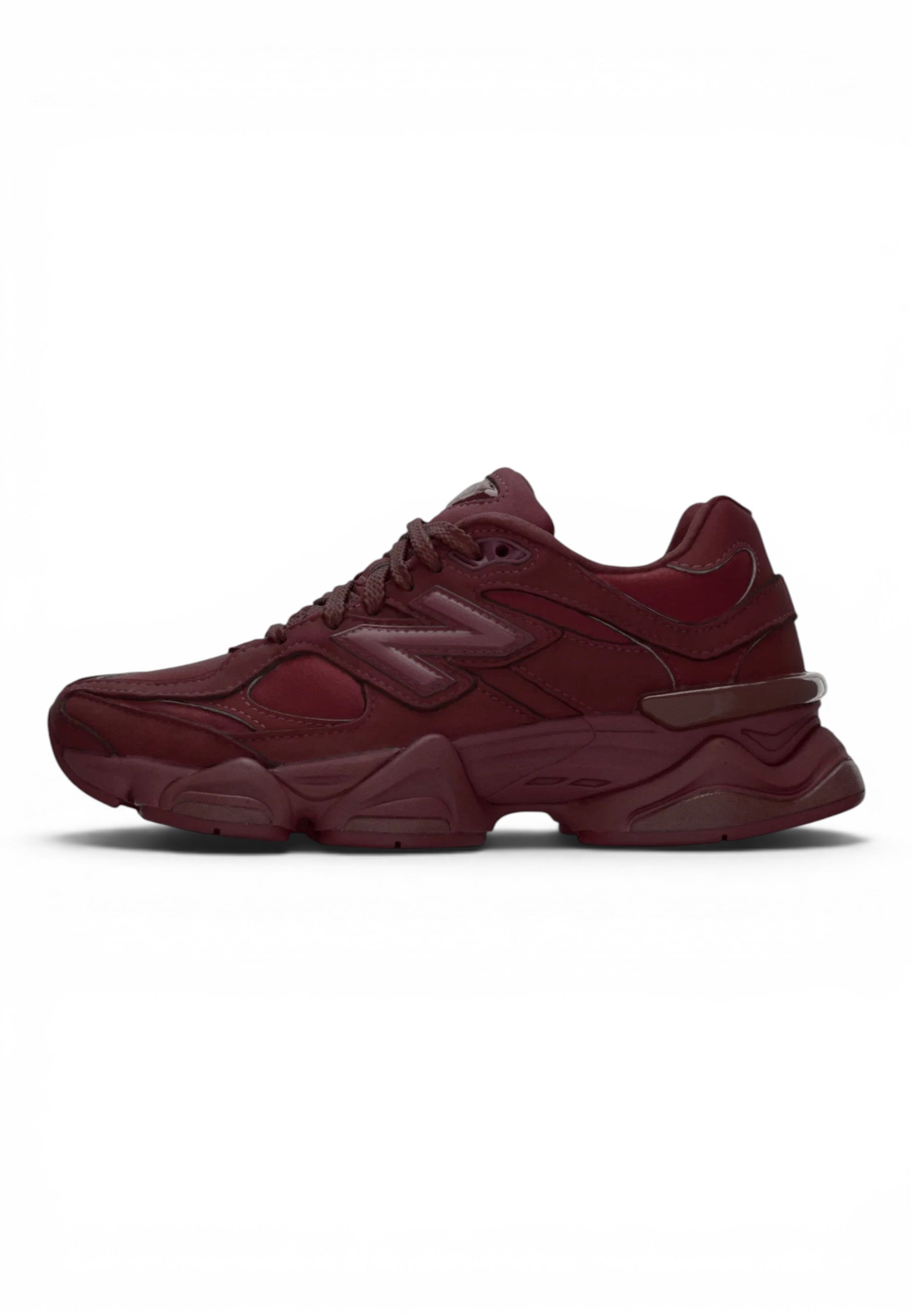 urbanstyle New Balance 9060 sneakers in monochromatic burgundy with suede and mesh textures and a chunky midsole.