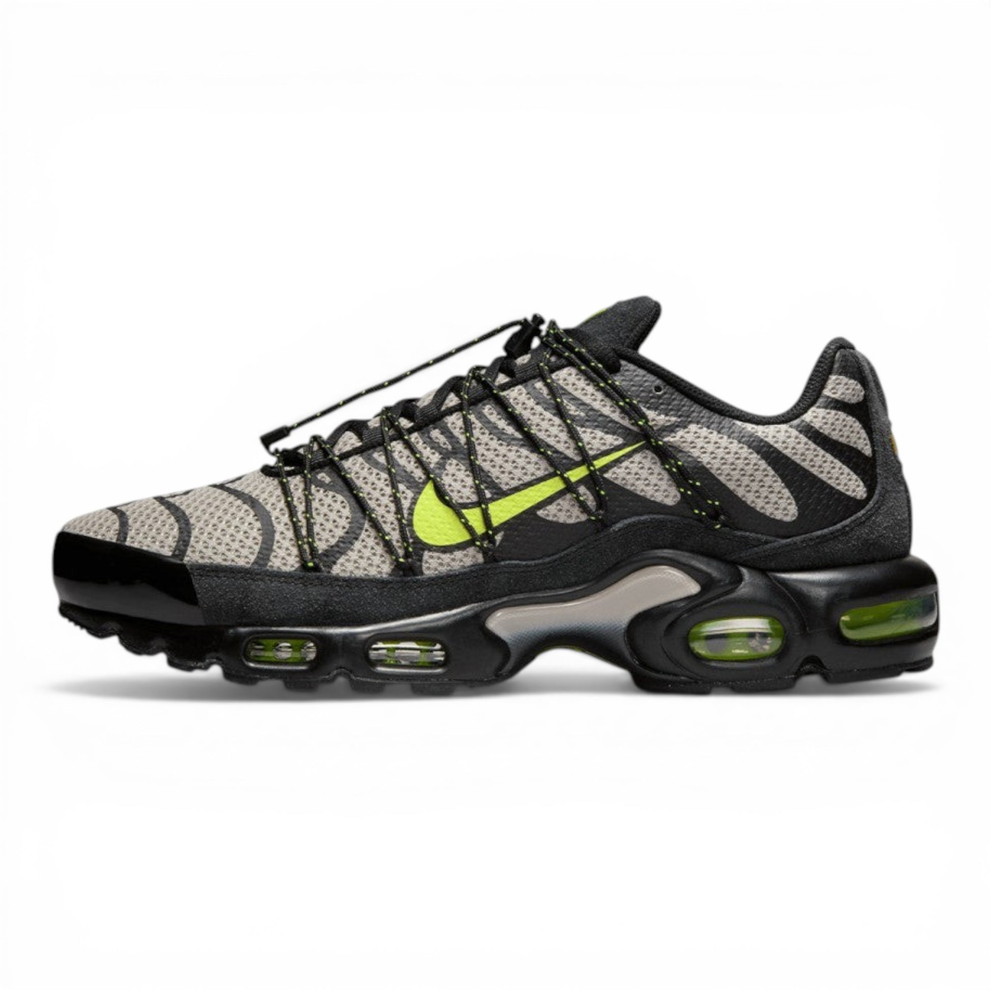 Urbanstyle Nike Air Max Plus sneakers with grey and black tiger stripes, volt green accents, and cushioned sole.