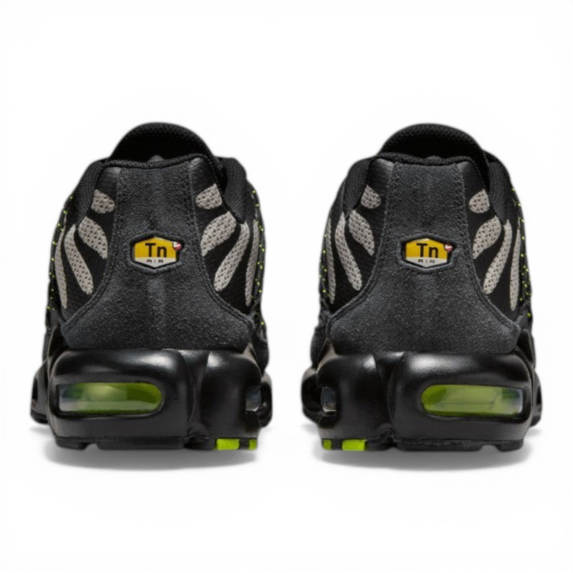 Urbanstyle Nike Air Max Plus Tn SE sneakers in black and grey with volt green accents and tiger stripe pattern.