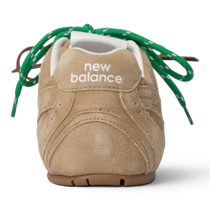 Urbanstyle New Balance tan suede low-top athletic sneakers with green and brown laces.